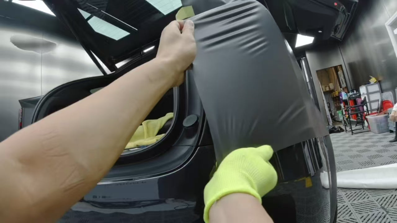 Stretchable Car Wrap Film Applied on Car Trunk Area, Showcasing Superior Stretchability and Easy Installation for Convenient DIY Car Wrapping.