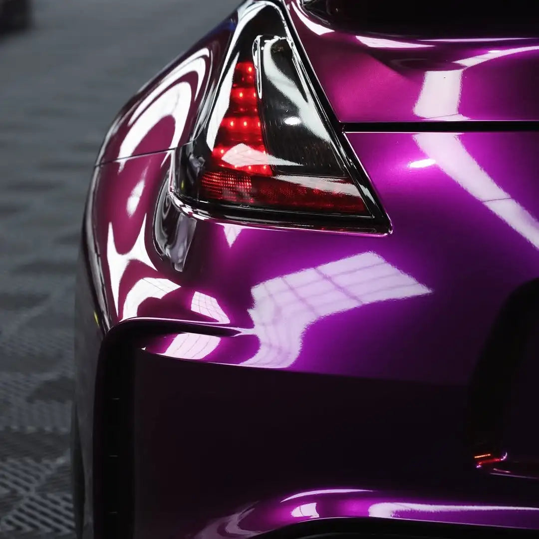 Detailed view of Audi Pearl Grape wrap on the left side of the Nissan Z rear - Kaleido