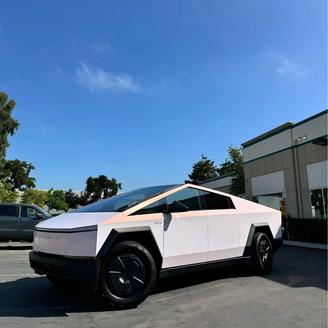Blossom Whisper color shift wrap on a Tesla Cybertruck - soft pink to white shift on the angular stainless steel body - Kaleido