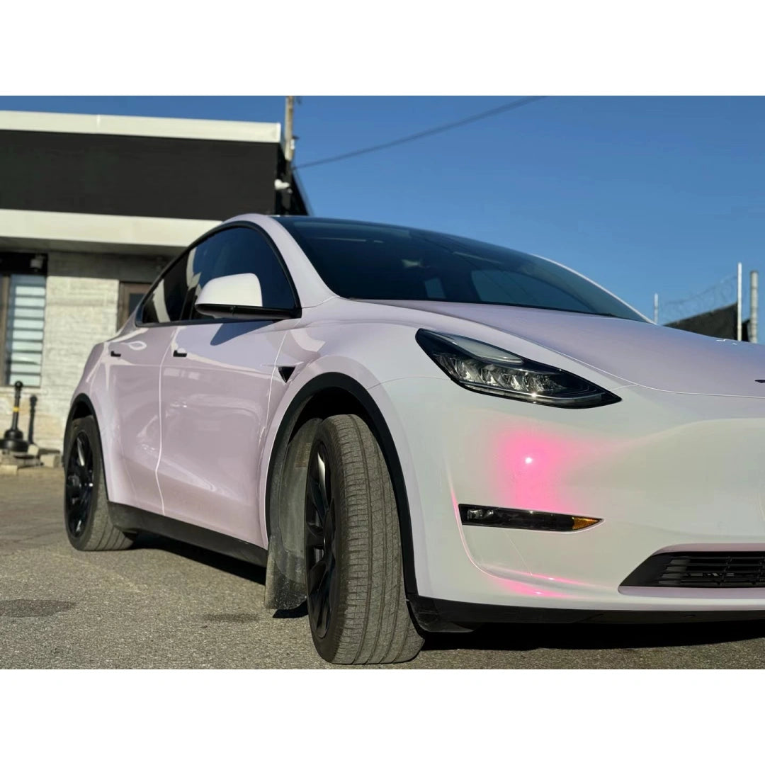 Close-up detail of Blossom Whisper color shift on Model Y front-left panel - delicate pink-white effect - Kaleido