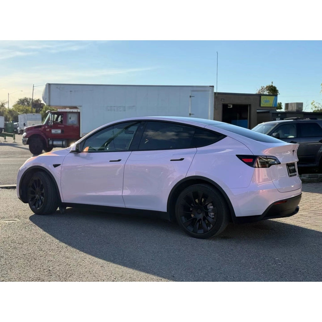 Full left side profile of Tesla Model Y with Blossom Whisper color shift wrap - Kaleido