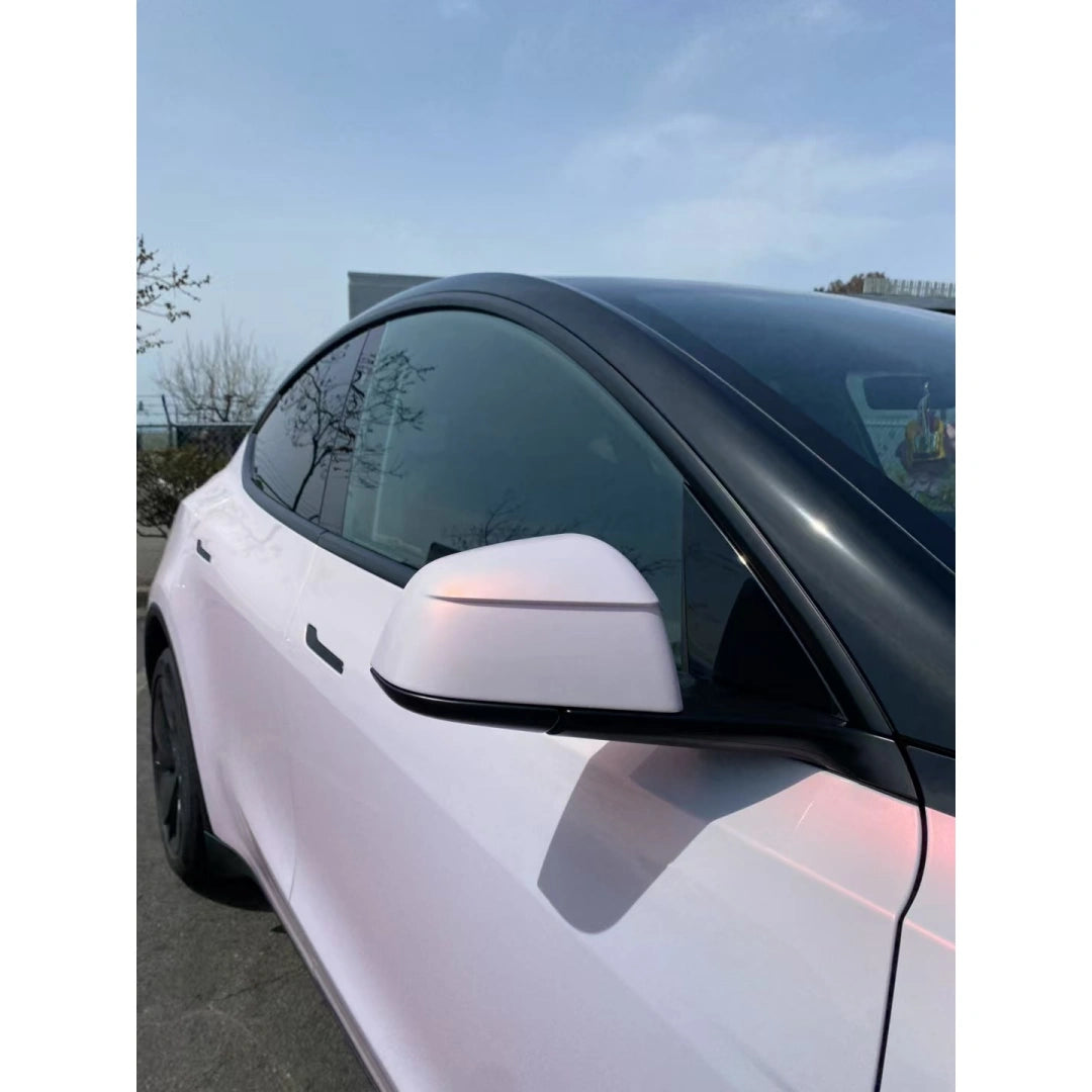 Extreme close-up of Blossom Whisper wrap on Tesla Model Y side mirror - delicate color shift detail - Kaleido