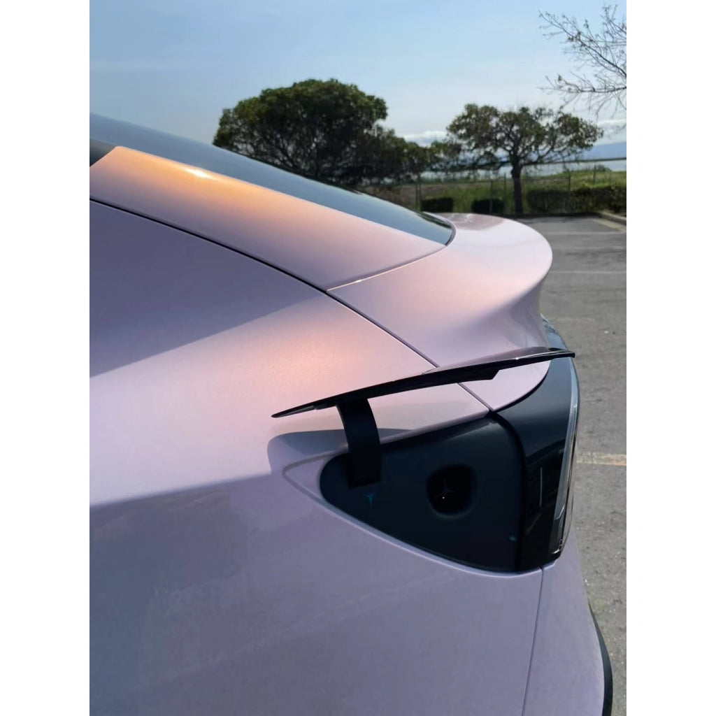 Tesla Model Y with Blossom Whisper film - rear-left view highlighting SUV silhouette - Kaleido