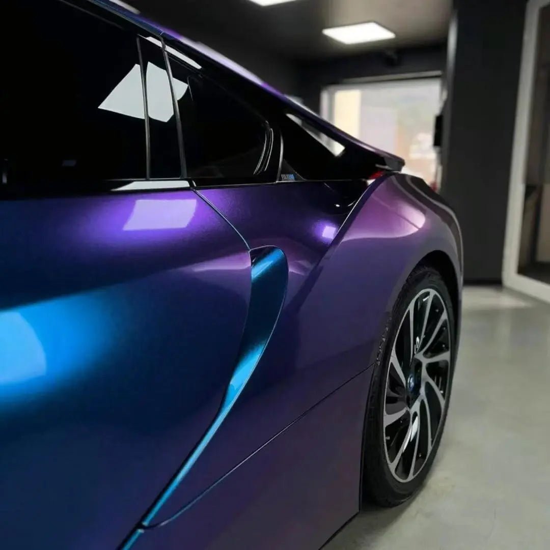 	Rear-left view of BMW i8 wrapped in Diamond Purple Blue color shift film - Kaleido