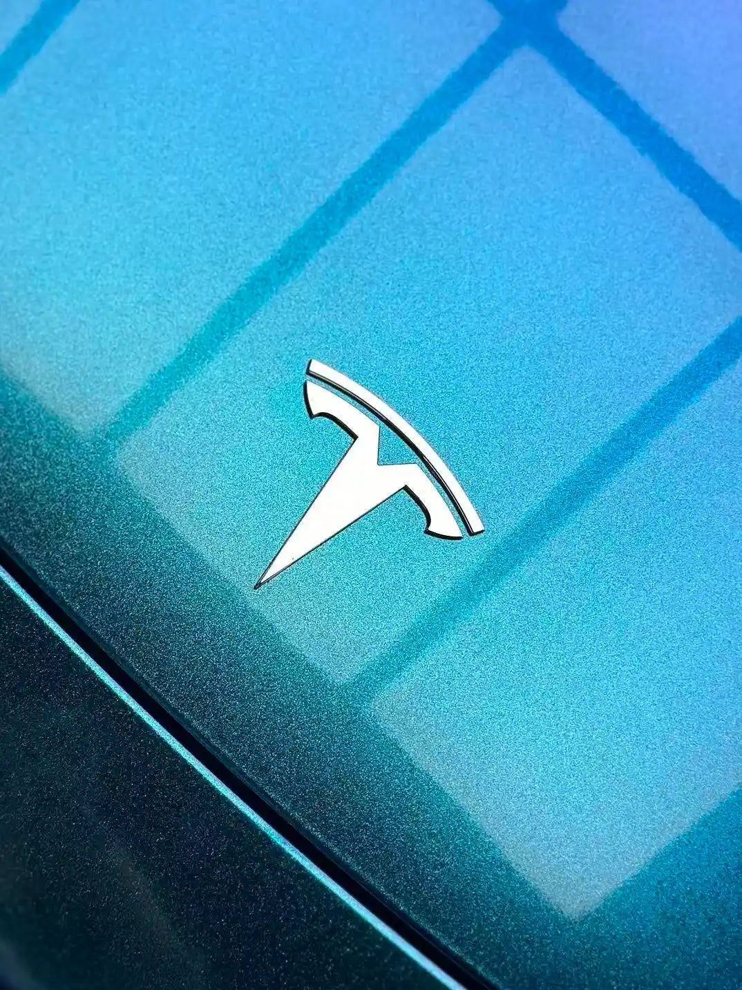 Close-up of Diamond Purple Blue color shift film on Tesla Model Y hood - purple to blue flakes - Kaleido