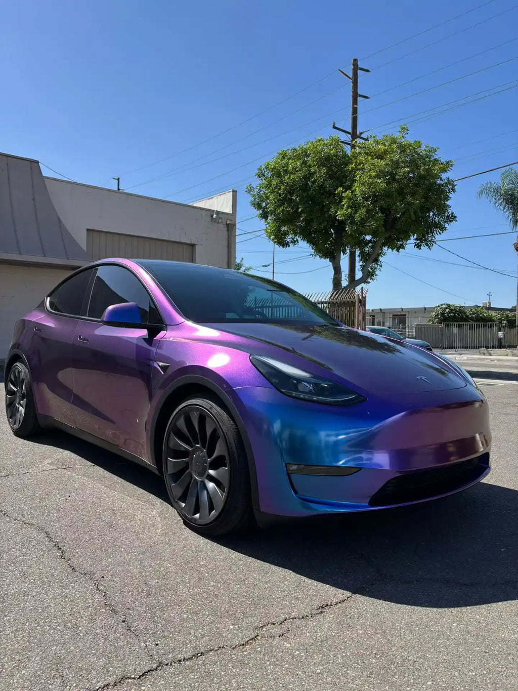 Tesla Model Y with Diamond Purple Red wrap - front-right angle with purple-red color shift - Kaleido