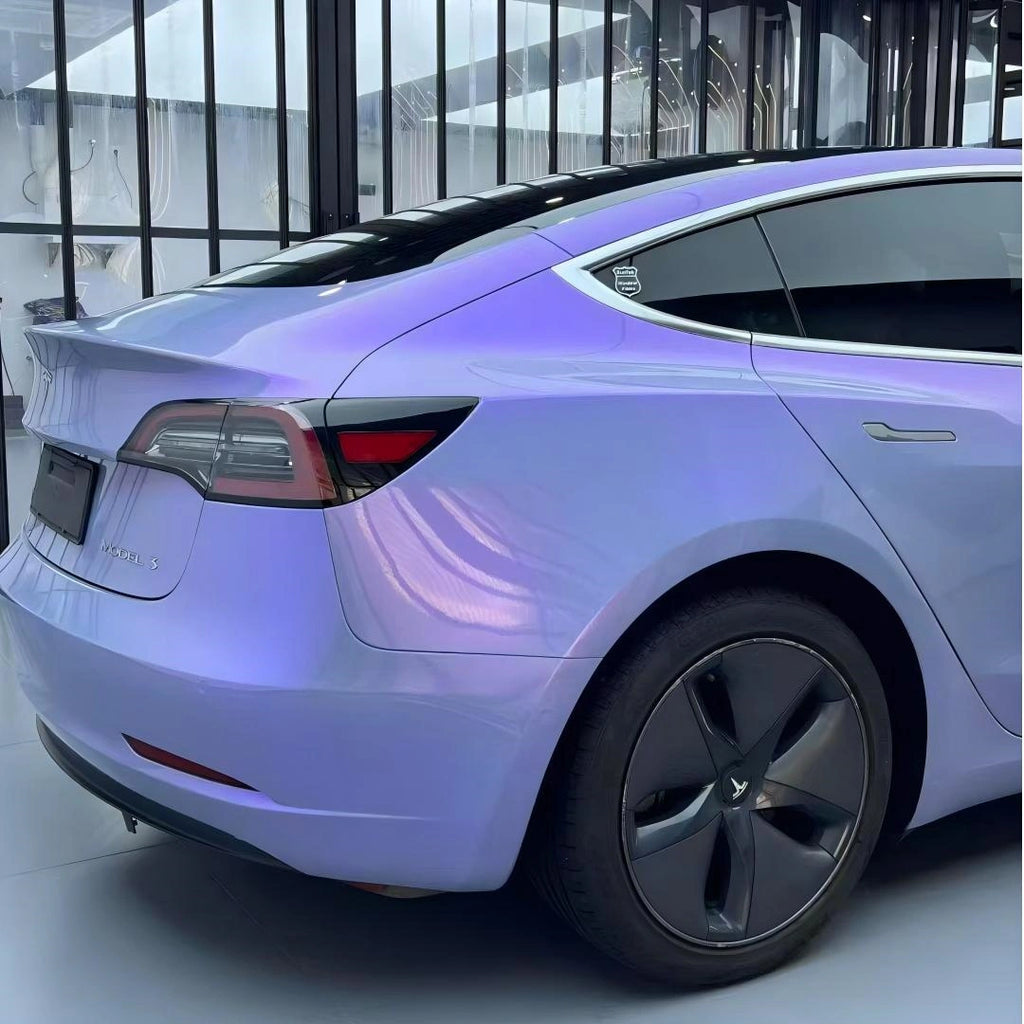 Mystic Violet vinyl wrap on Tesla Model 3 - rear-right angle showing chameleon finish - Kaleido