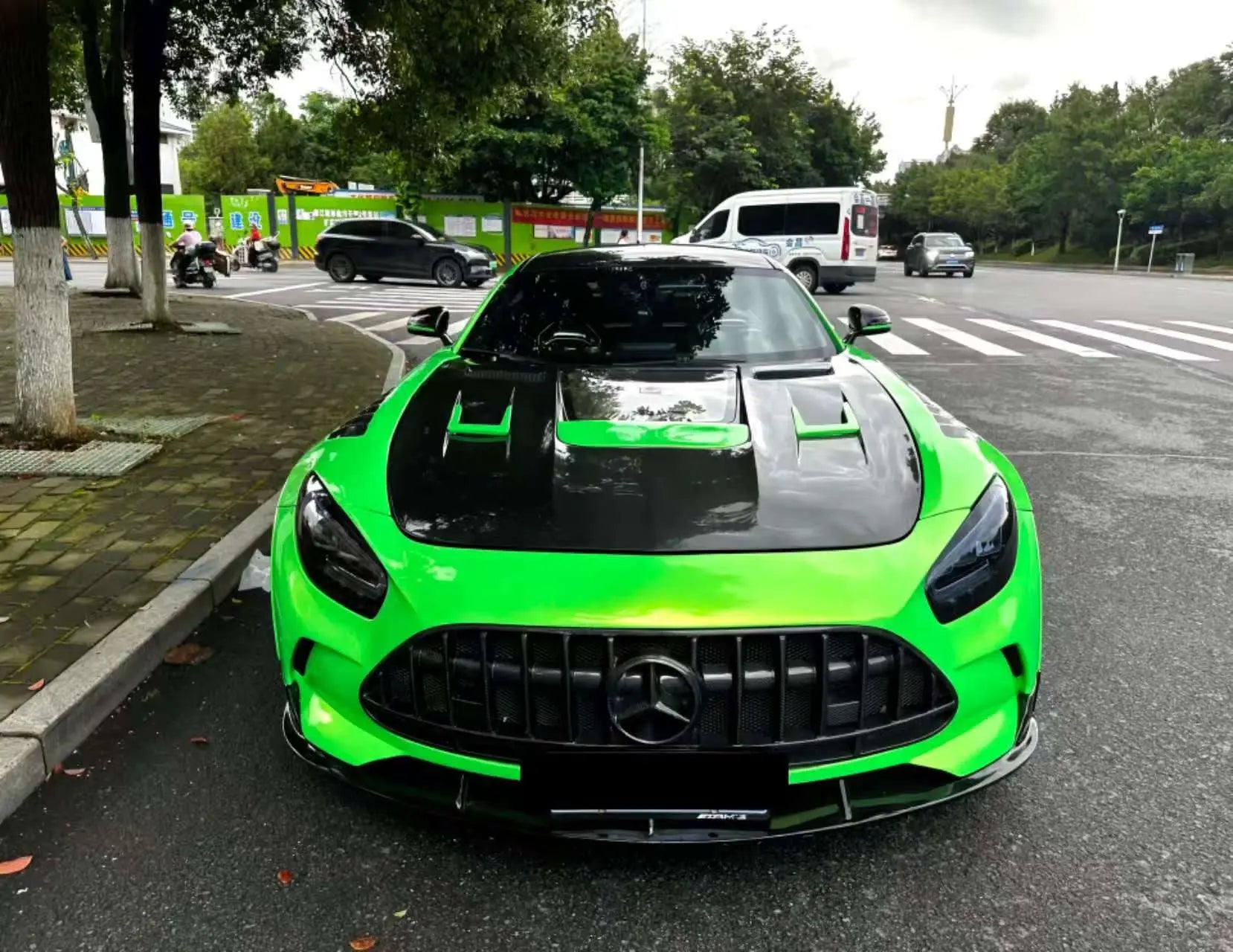 Front view of Neon Gold Green wrapped AMG GT - custom widebody styling - Kaleido