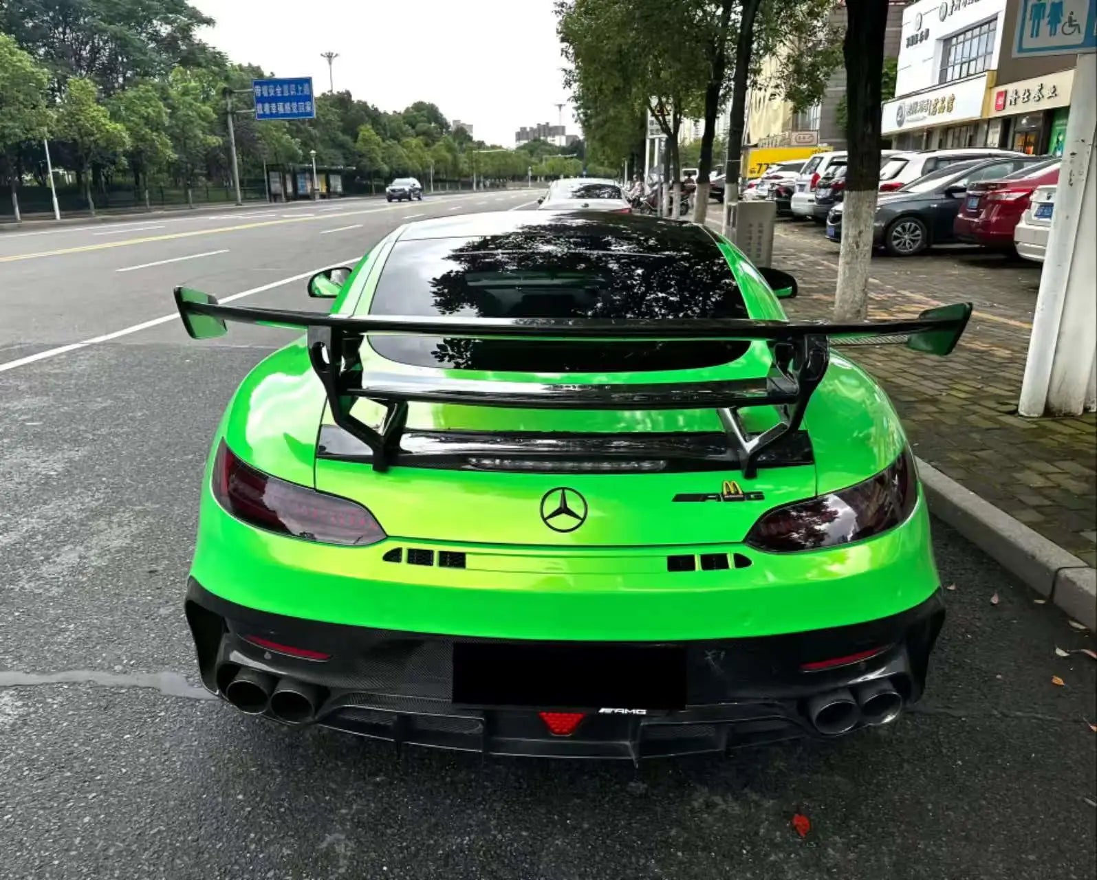 Neon Gold Green color shift wrap on modified Mercedes-AMG GT rear - showcasing aggressive diffuser - Kaleido