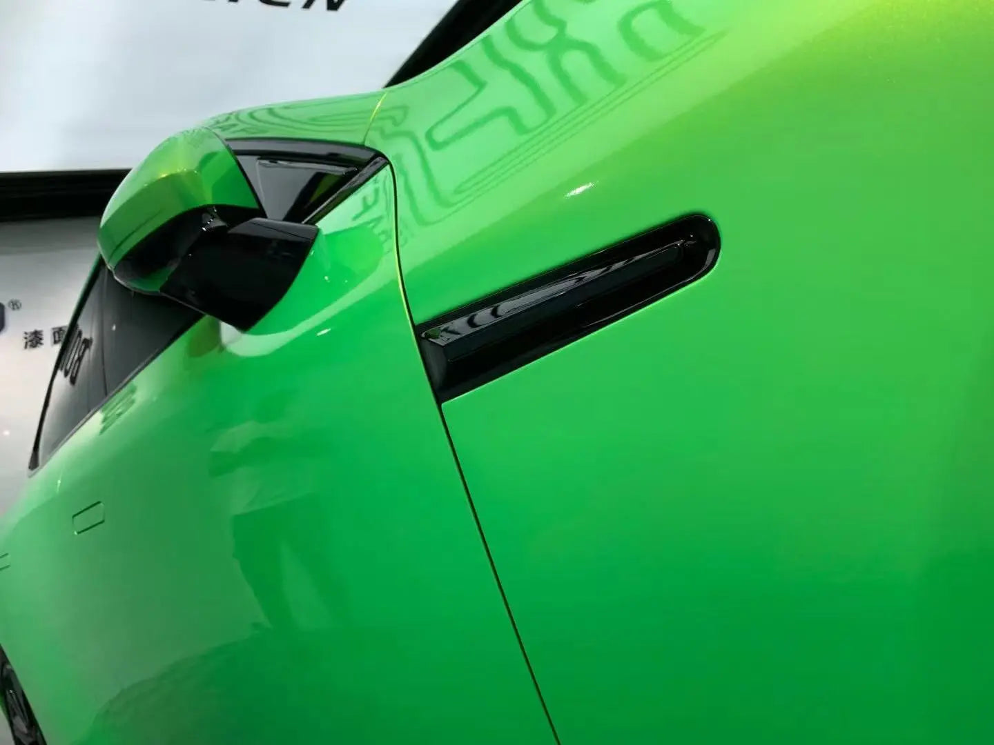 Neon Gold Green film on Xpeng P7 front fender - color shift detail on body panel - Kaleido