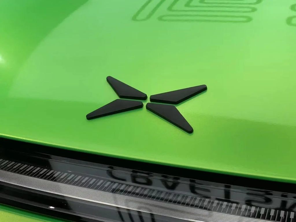 Close-up of Neon Gold Green wrap on Xpeng P7 hood - dramatic color transformation visible - Kaleido