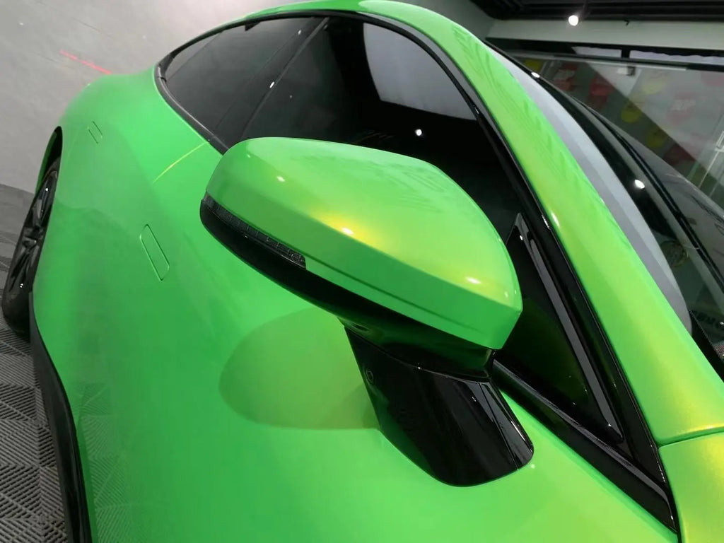 Neon Gold Green color shift wrap on Xpeng P7 side mirror - showcasing clean edges and color shift effect - Kaleido