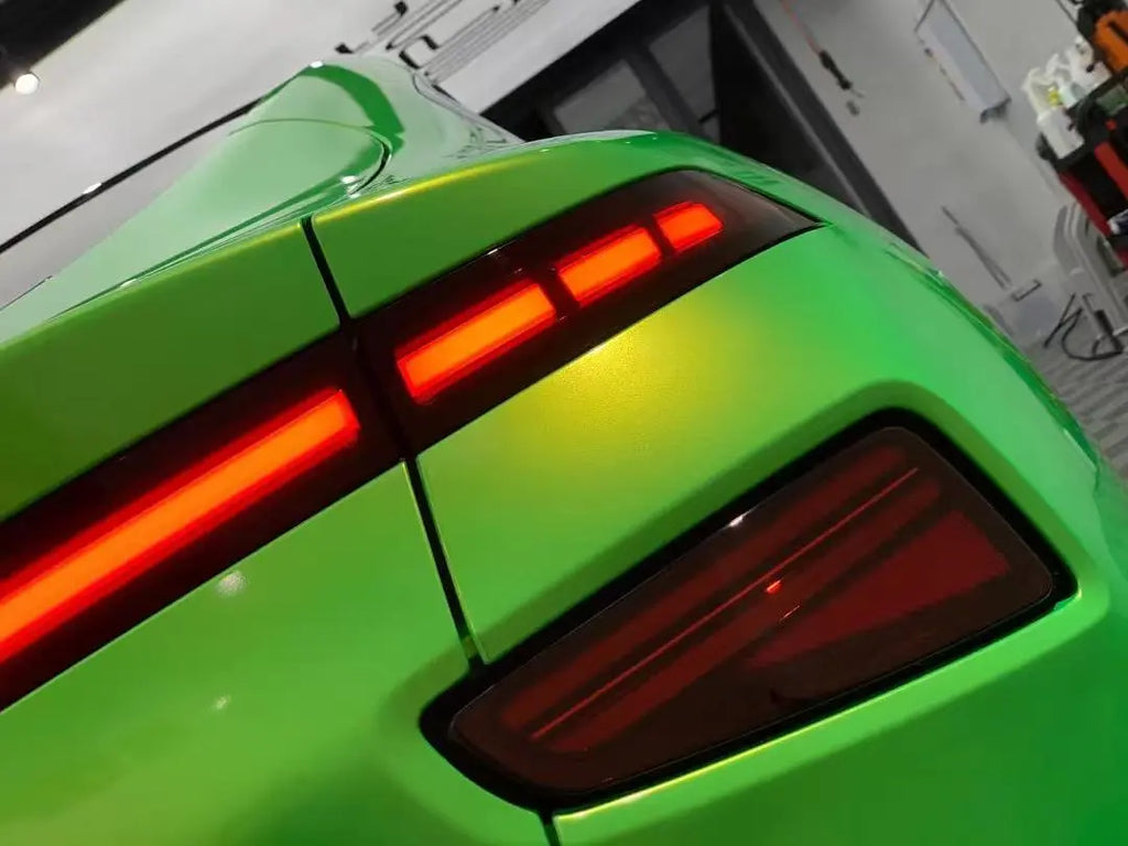Detailed view of Neon Gold Green vinyl on Xpeng P7 taillight area - seamless installation - Kaleido