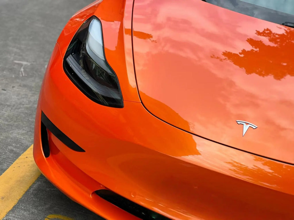 Neon Gold Orange color shift vinyl on Tesla Model 3 front bumper and hood - dramatic color effect - Kaleido