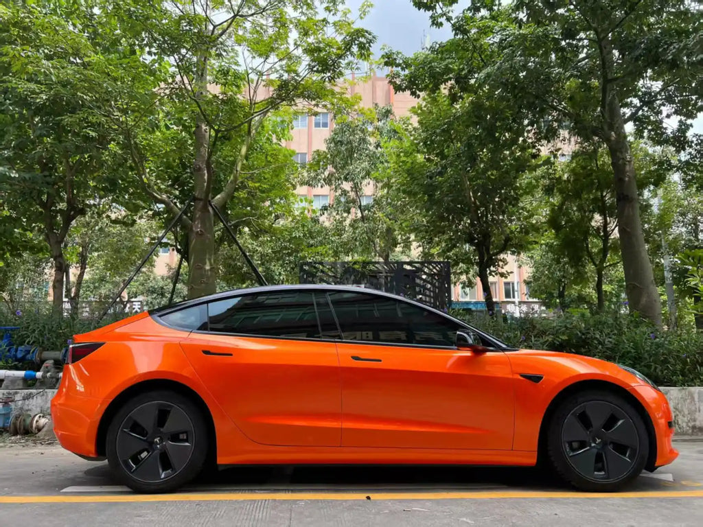 Full side view of Neon Gold Orange wrapped Tesla Model 3 - complete color presentation - Kaleido