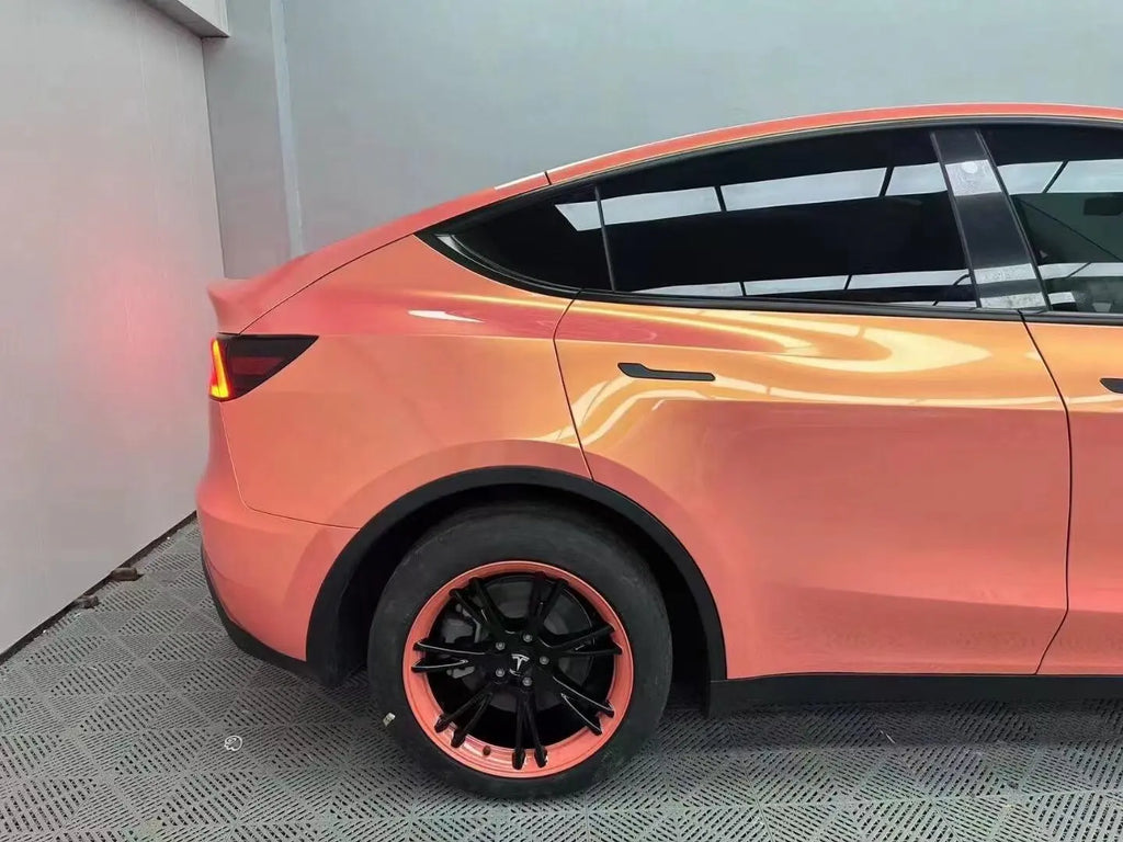 Neon Gold Pink wrap on Tesla Model Y door and fender - seamless panel transition - Kaleido