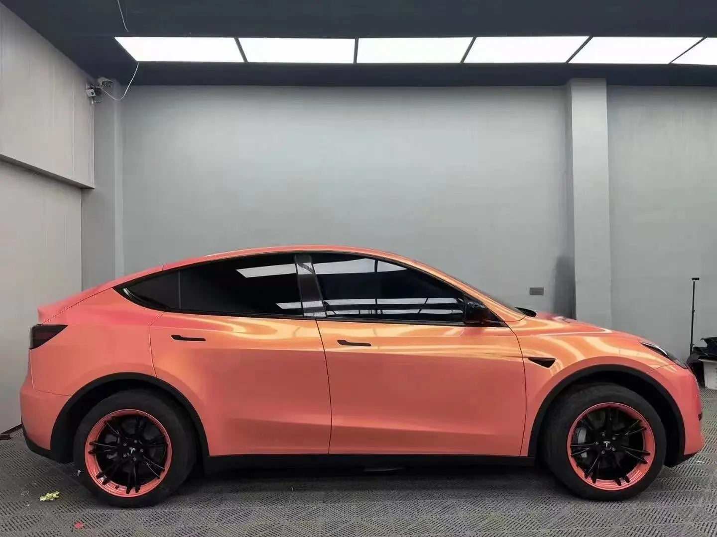 Full side view of Tesla Model Y in Neon Gold Pink color shift vinyl - Kaleido