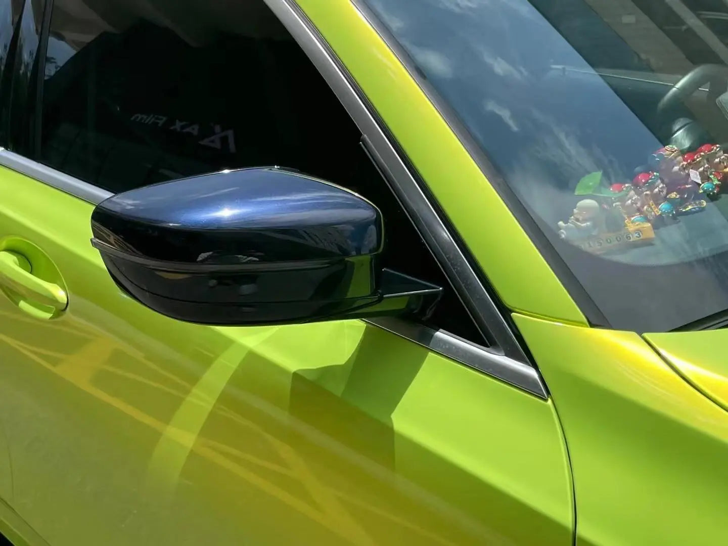 Mirror view of Neon Yellow wrapped BMW 5 Series - unique perspective - Kaleido