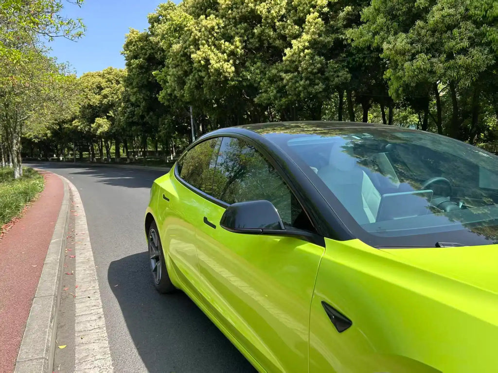 45-degree detail shot of Neon Yellow film on Tesla Model 3 door - Kaleido