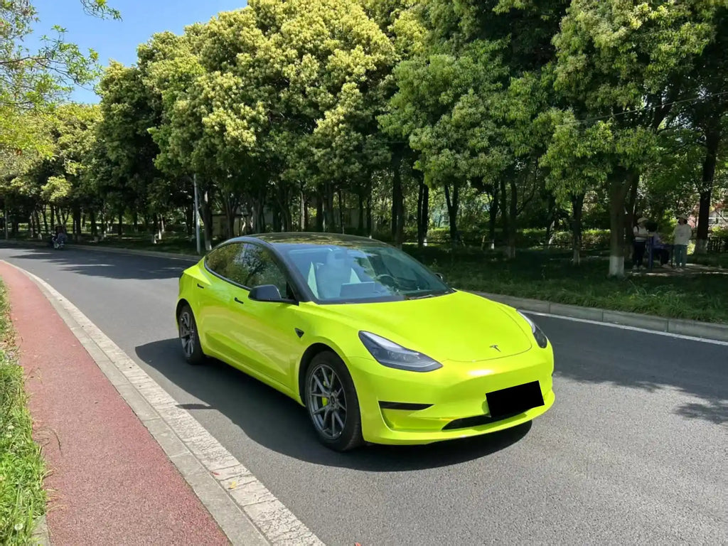 Wide front-right view of Neon Yellow wrapped Tesla Model 3 - Kaleido