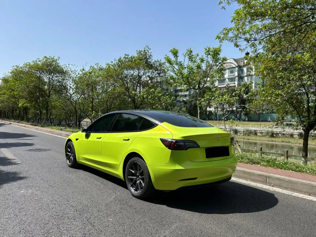 Neon Yellow color shift vinyl on Tesla Model 3 rear-left - Kaleido