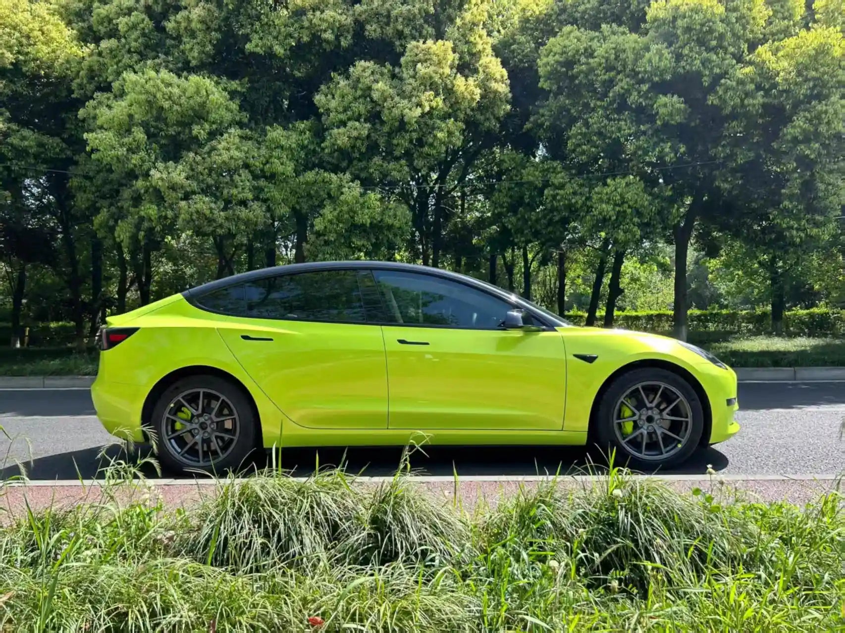 Full side view of Tesla Model 3 with Neon Yellow color shift film - Kaleido