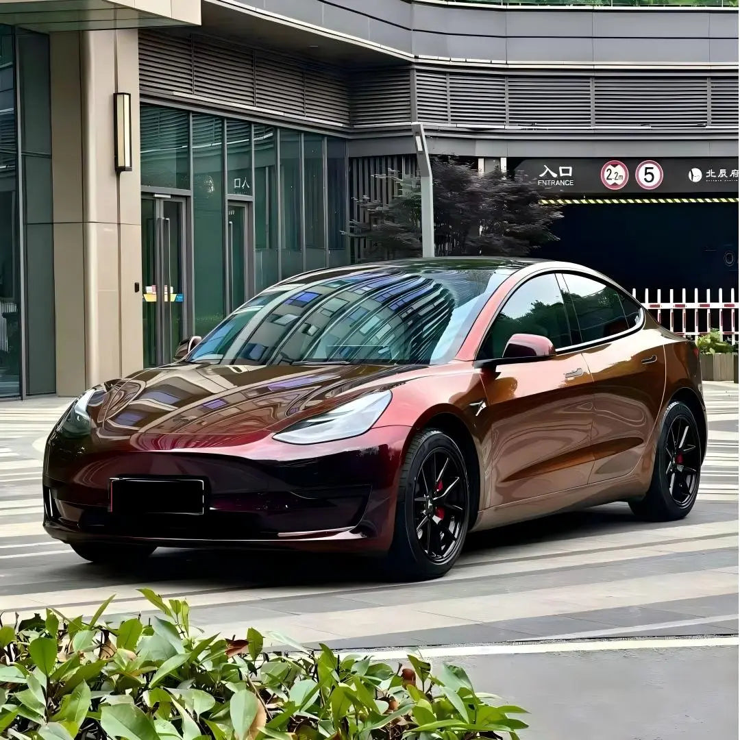 Onyx Ignition color shift wrap on Tesla Model 3 - front-left view showing black to red transition - Kaleido