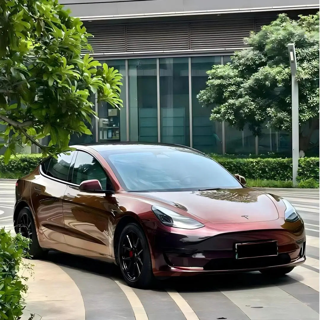 Tesla Model 3 in Onyx Ignition color shift vinyl - front-right angle showcasing dramatic color change - Kaleido
