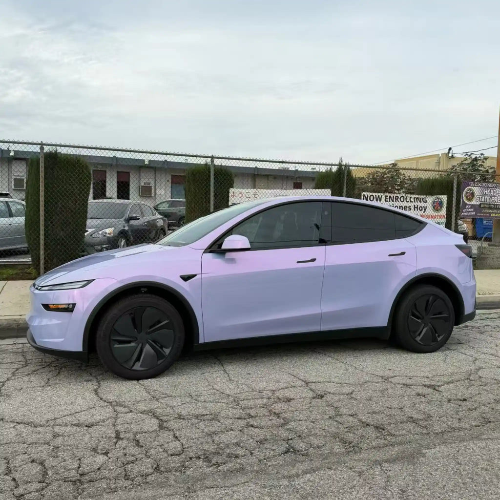 Left side profile of Tesla Model Y in Color Shift Pearl Blue Pink vinyl wrap - Kaleido