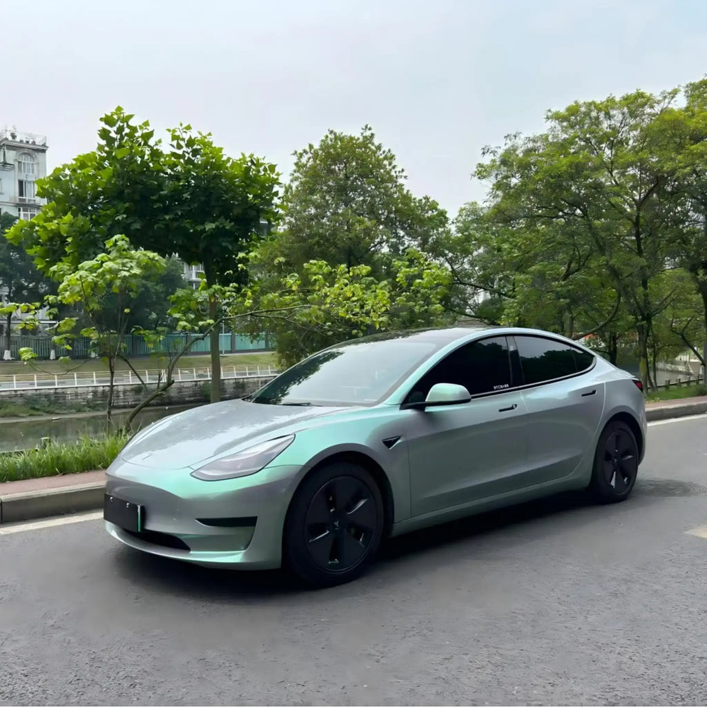 Phantom Moss color shift wrap on Tesla Model 3 - front-left view showing grey to green transition - Kaleido