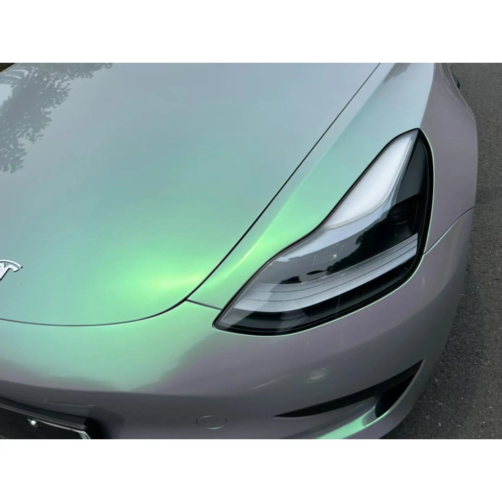 Macro detail of Phantom Moss vinyl on Model 3 front-left - chameleon flakes - Kaleido