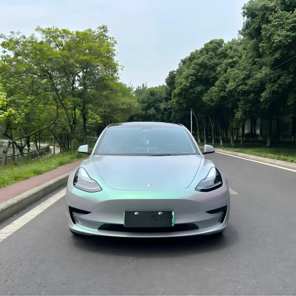Front view of Tesla Model 3 wrapped in Phantom Moss color shift film - Kaleido