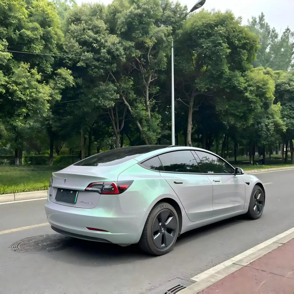 Tesla Model 3 with Phantom Moss color shift film - rear-right view - Kaleido