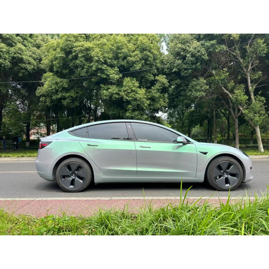 Full side profile of Tesla Model 3 in Phantom Moss color shift wrap - Kaleido