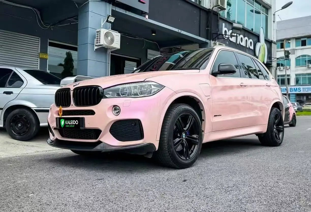 BMW X5 in Color Shift Pink Purple vinyl - front-left angle - Kaleido