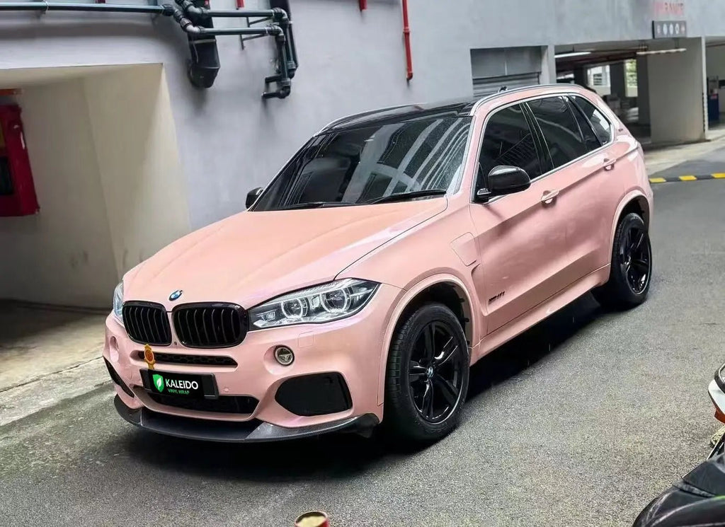 Top-down front-left view of BMW X5 in Color Shift Pink Purple color shift wrap - Kaleido