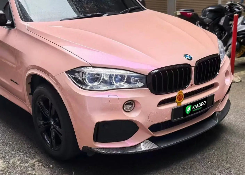 Close-up of Color Shift Pink Purple vinyl on BMW X5 front-right - Kaleido