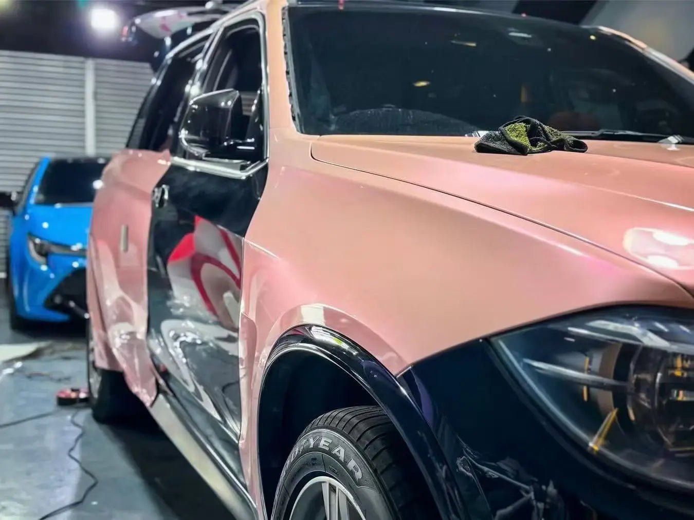 Installation detail of Color Shift Pink Purple film on BMW X5 - precise edge work - Kaleido