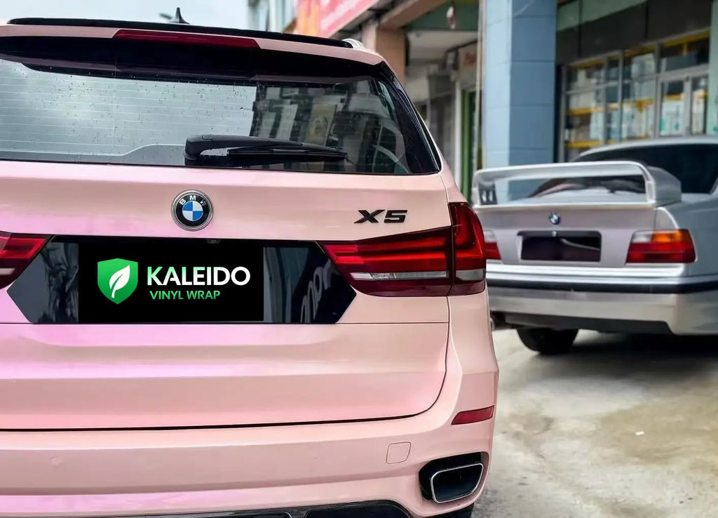 Detailed shot of Color Shift Pink Purple wrap on BMW X5 rear - Kaleido
