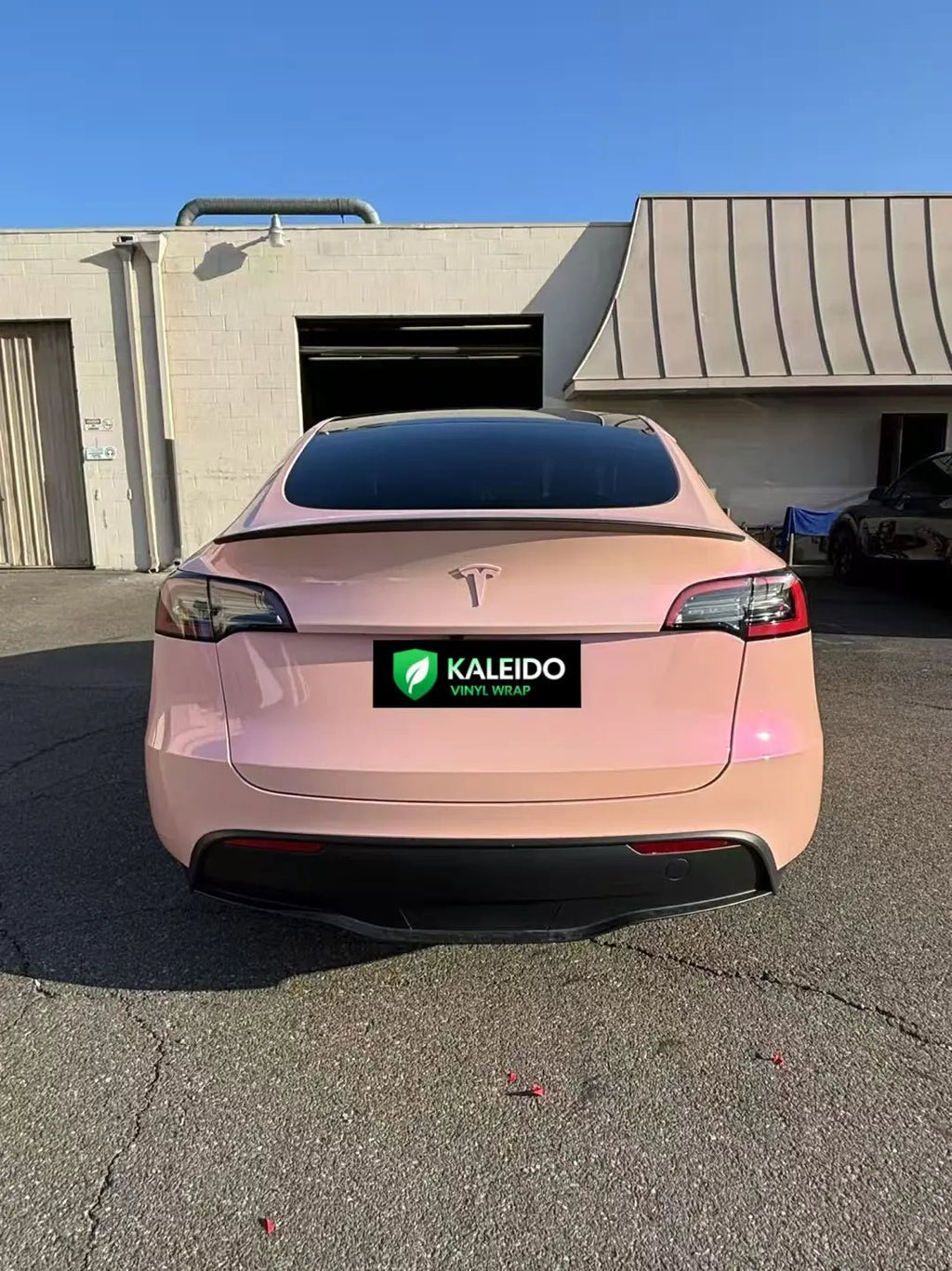 Rear view of Tesla Model Y in Color Shift Pink Purple color shift wrap - Kaleido