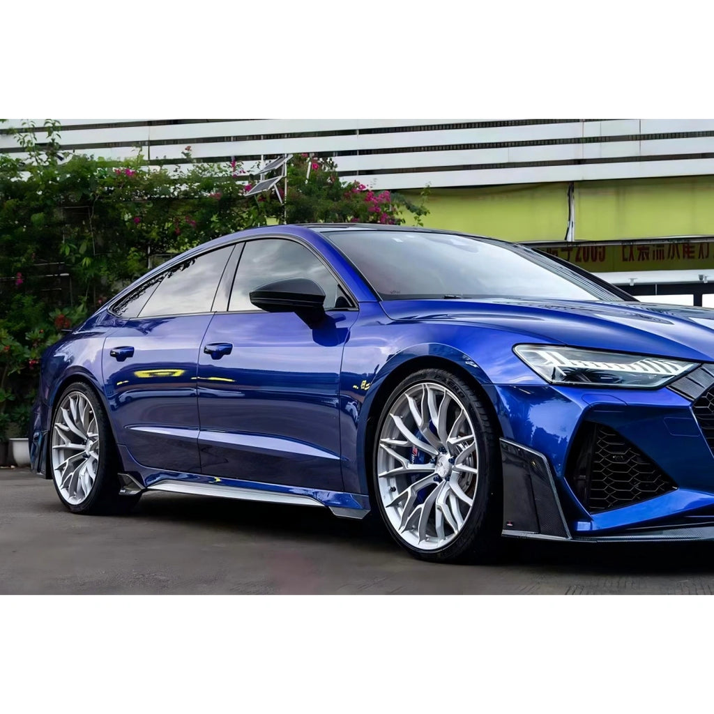 Audi RS7 in Deep Blueberry Metallic vinyl wrap, front-right angle highlighting the sporty grille and fastback silhouette - Kaleido