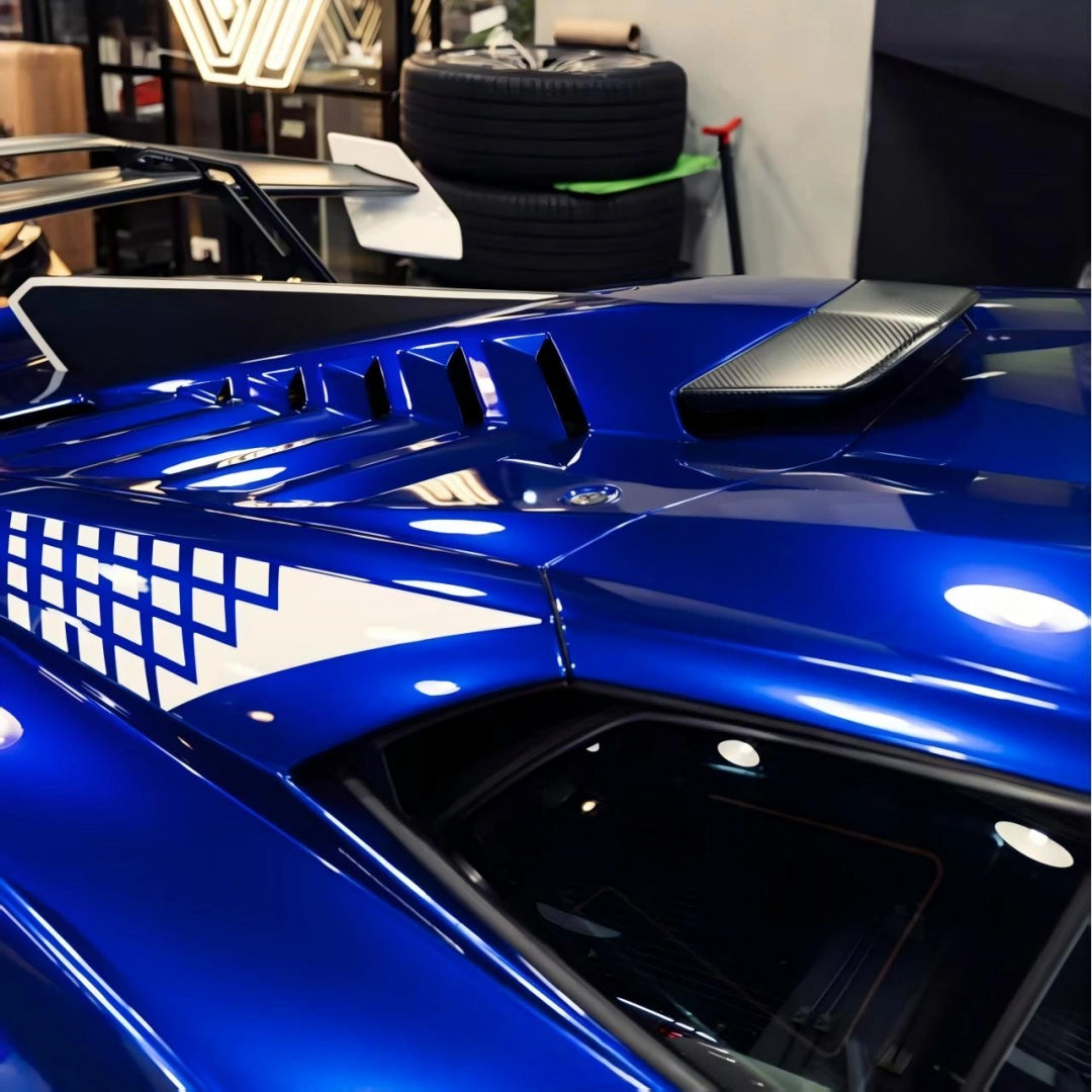 Close-up of the Deep Blueberry Metallic wrap on the Lamborghini Huracán STO's roof and engine cover vents[citation:2] - Kaleido