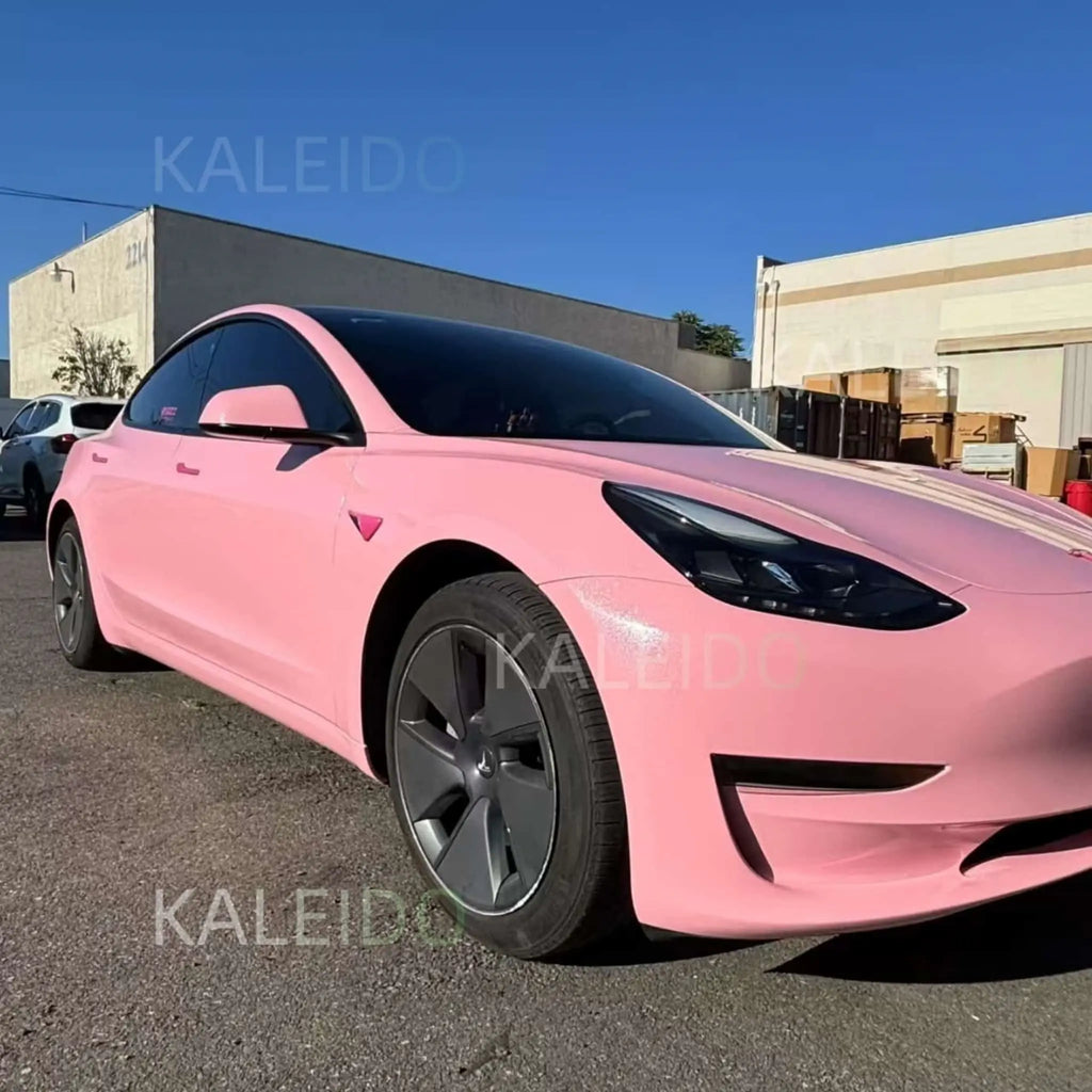 Wide front-right view of Diamond Iridescent Rouge Pink wrapped Tesla Model Y - Kaleido