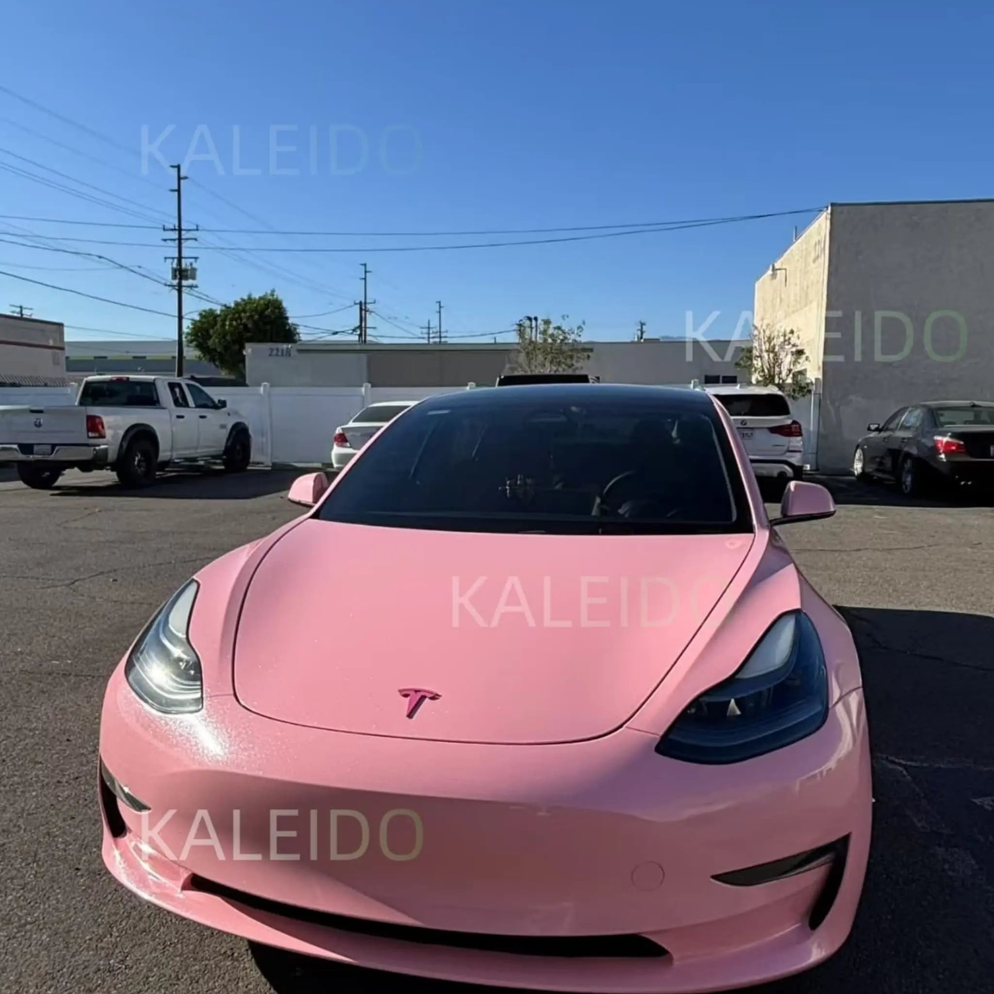 Front view of Tesla Model Y in Diamond Iridescent Rouge Pink vinyl wrap - Kaleido