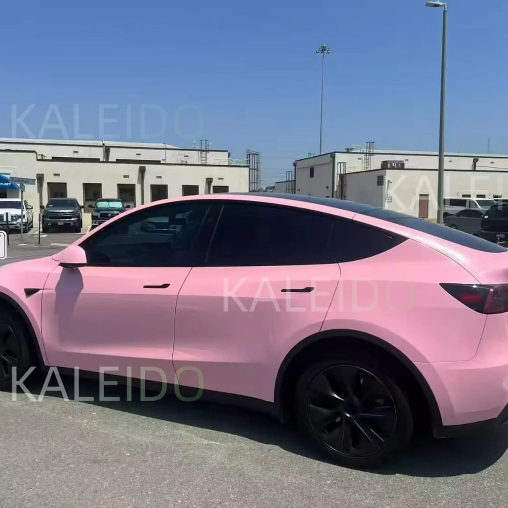 Tesla Model Y in Diamond Iridescent Rouge Pink - rear-left view with diamond sparkle effect - Kaleido