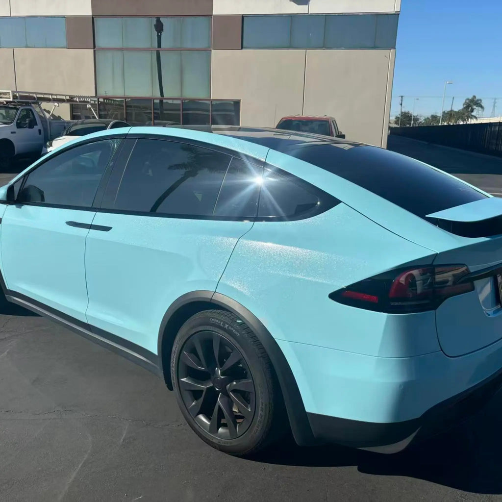 Diamond Iridescent Sea Mist Blue wrap on Tesla Model X - rear-left view - Kaleido