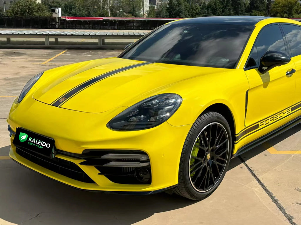 Close-up front-left detail of the vibrant Gloss Corn Yellow finish on a Porsche Panamera - Kaleido