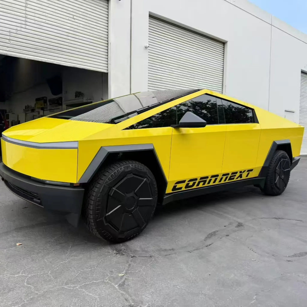 Wide front-left view of the angular Tesla Cybertruck in vibrant Gloss Corn Yellow wrap - Kaleido