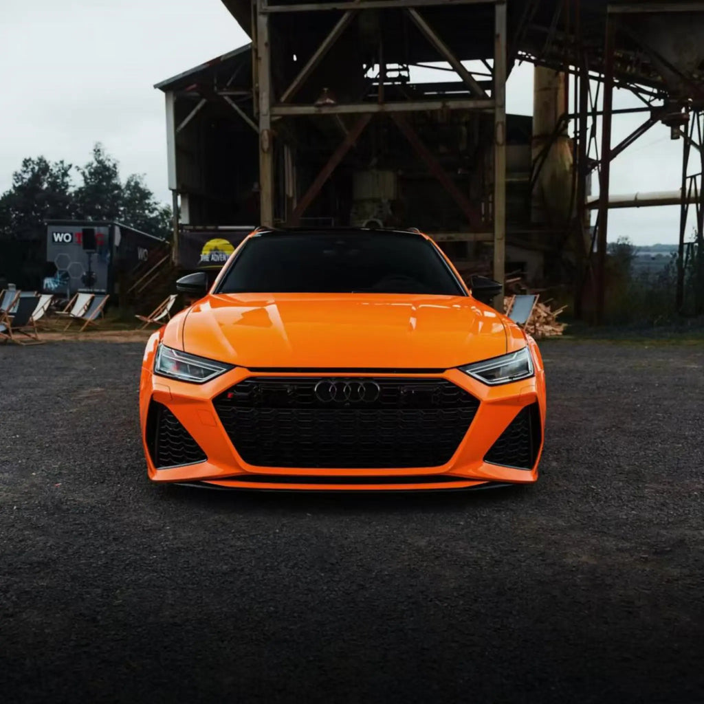 Front view of an Audi RS6 Avant (C8) performance wagon in Gloss Hermès Orange wrap - Kaleido