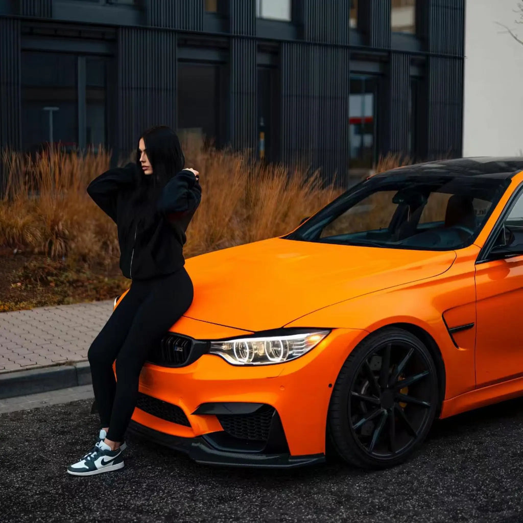 Close-up of the front-left corner on a Gloss Hermès Orange wrapped BMW M3 (F80) - Kaleido